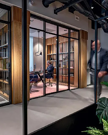 Glazed meeting room with timber shelving